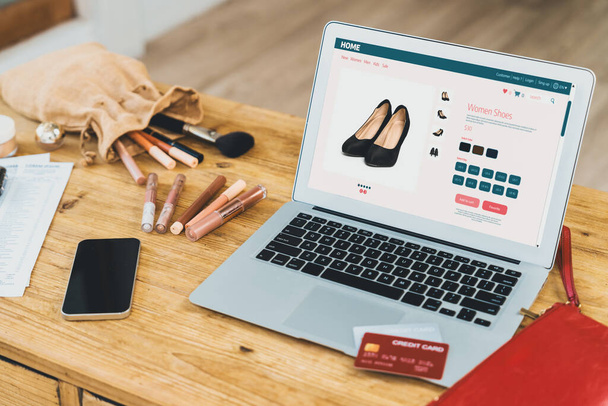 Woman shopping online on internet marketplace browsing for sale items for modern lifestyle and use credit card for online payment from wallet protected by crucial cyber security software - Photo, Image