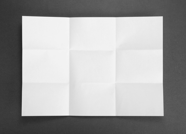 White sheet of paper folded in nine top shooting. - Φωτογραφία, εικόνα
