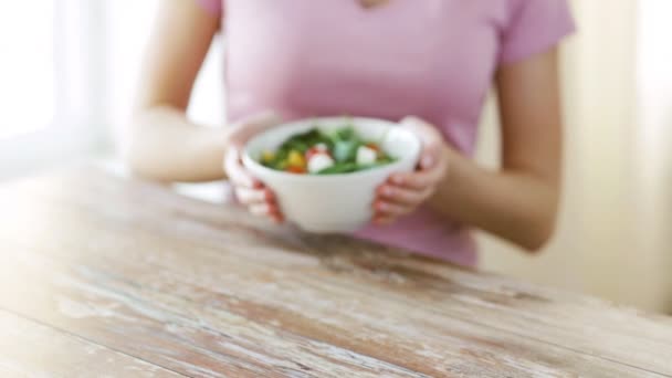 close up of young woman hands showing salad bowl - Filmmaterial, Video