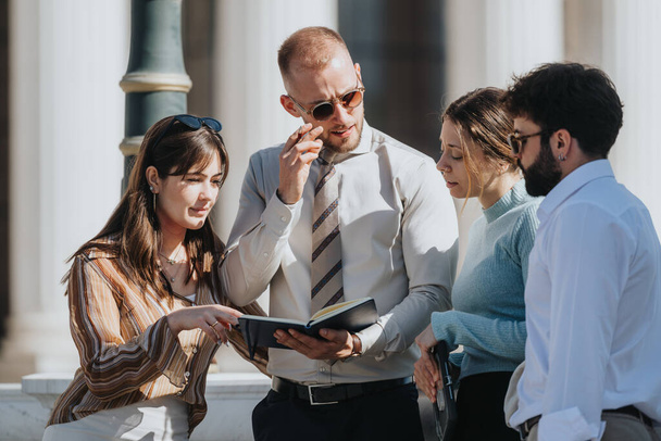 Young, smart business team analyzing market trends and discussing business expansion outdoors. They prioritize profitability, sales strategy, and sustainable growth. - Photo, Image