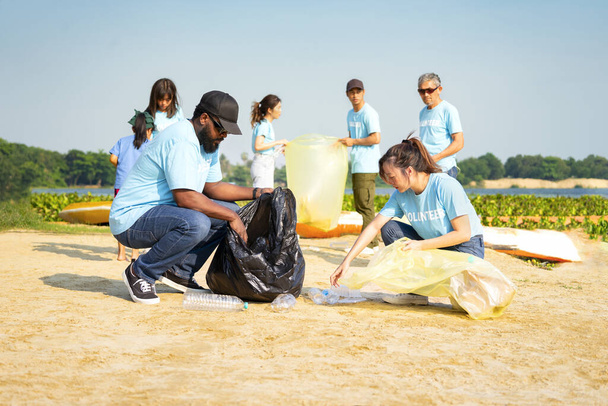 group of diverse people,environmental conservation activist keeping plastics waste by the river,volunteers,plastic waste,environmental conservation - Photo, image