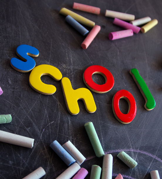 colored chalks numbers and letters on blackboard - Foto, Bild