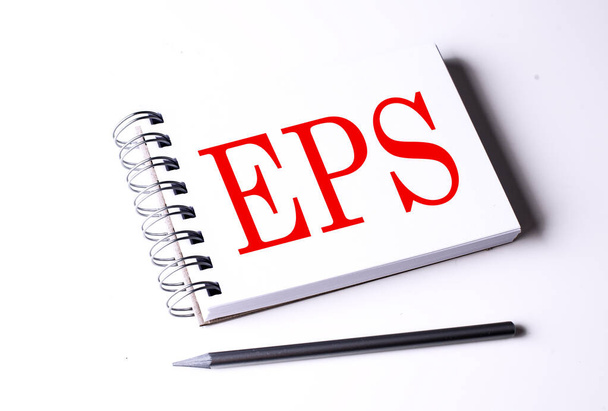 Tekst EPS na notatniku na białym tle, biznes - Zdjęcie, obraz