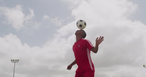 Man, soccer ball and head for sports game or competition workout, outdoor skill or sky background. Male person, football player and talent practice for match sportswear or exercise, athlete or play. - Footage, Video