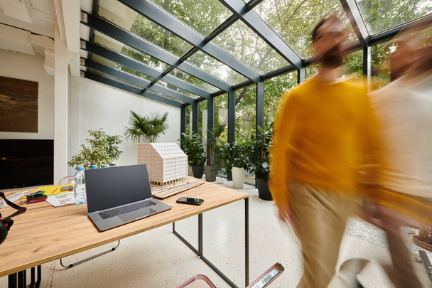 long exposure photo of dedicated smart coworkers moving around their office, startup, motion blur - Photo, Image