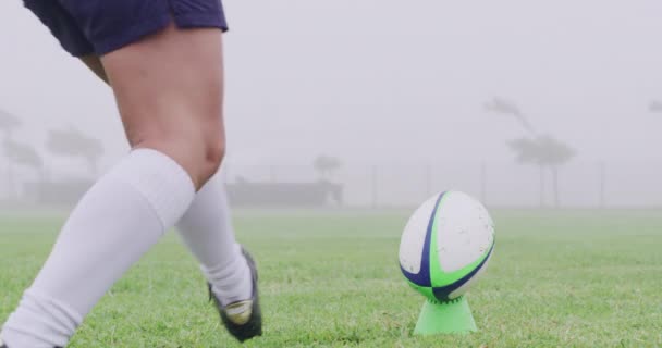 Rugby, kick and legs of person with ball on field at game, match or competition action at club. Sports, fitness and player on grass with exercise, workout and training on green pitch with morning fog. - Footage, Video
