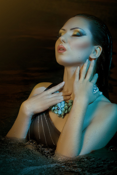 Beautiful woman with makeup in water - Photo, Image