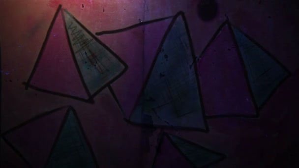 Video motion  graffiti pyramid, triangle ornament night light moves along the wall abstract background  pattern hd 1920x1080 - Footage, Video