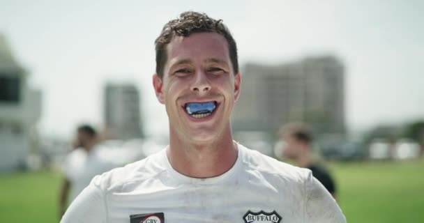 Rugby, man and face in mouthguard for sports game, field and happy player with fitness in stadium. Athlete, pride and portrait for competition training in practice and confident professional in club. - Footage, Video