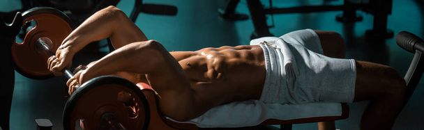 Muscular man with barbell. Banner templates with muscular man, muscular torso, six pack abs muscle - Φωτογραφία, εικόνα