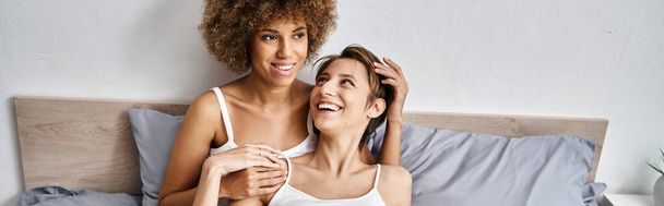 happy african american woman with curly hair having great time with girlfriend in morning, banner - Photo, Image