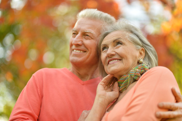 Senior couple in autumn park - Фото, зображення