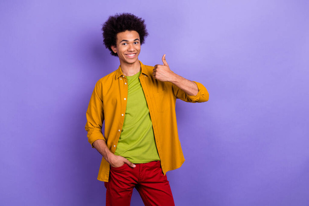 Photo of successful nice glad man wear stylish yellow clothes showing thumbs up good news offer isolated on violet color background. - Фото, изображение