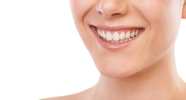 Happy woman, teeth and smile for dentist, mouth hygiene or dermatology against a white studio background. Closeup of female person for tooth whitening in dental, oral or gum care on mockup space. - Photo, Image