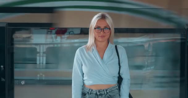 Portrait, woman in subway, moving train. Confident native resident of huge city metropolis on subway platform metro station against of moving train. City hustle and bustle, active energetic urban life - Footage, Video