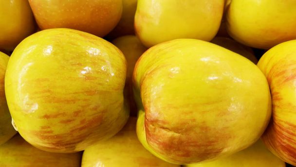 Fresh fuji apples in a pile in a grocery store produce backgrounds - Photo, Image