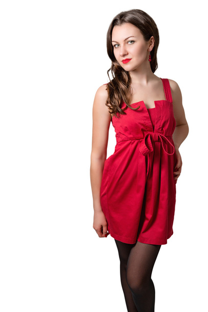 Bir güzel genç seksi kadın kısa kırmızı elbise portresi. - Fotoğraf, Görsel