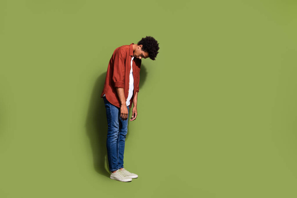 Full length photo of nice young male bend sleepy unhappy tired wear trendy brown garment isolated on khaki color background. - Fotó, kép