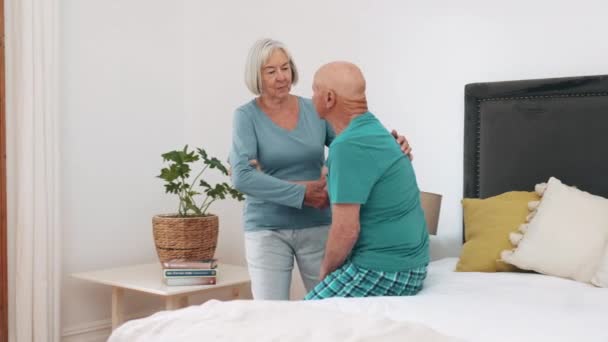 Wife, help or old husband in bedroom care mobility walk, comfort or marriage. Senior partnership, woman and wake up relationship or injury rehabilitation, person with a disability or assistance trust. - Footage, Video