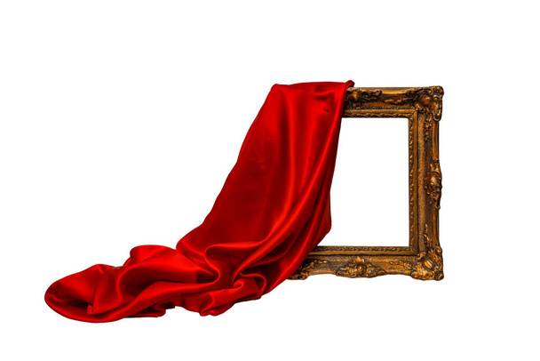 Rood satijnen weefsel, onthulling van een goudbruin frame, bewegingsvervaging zwevend geïsoleerd op witte achtergrond, luxe achtergrond close-up - Foto, afbeelding