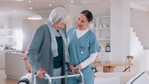 Nurse, rehabilitation and senior woman on walker in nursing home, help and healthcare. Happy caregiver, person with a disability and walking frame, medical support and physical therapy or consulting. - Footage, Video