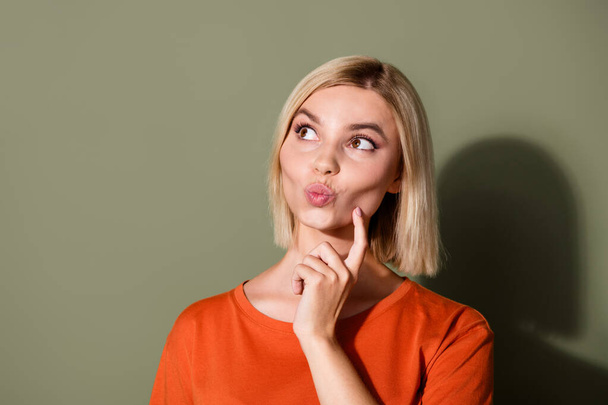 Photo portrait of lovely young lady touch cheek look lips empty space dressed stylish orange garment isolated on khaki color background. - Фото, зображення