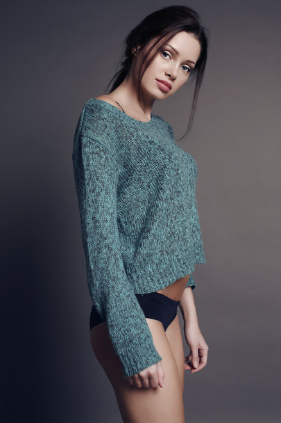 woman with dark hair and natural makeup in cozy cardigan  - Photo, Image