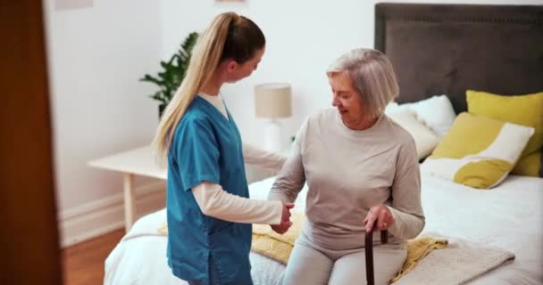 Senior, woman or caregiver with walking stick for help, support and movement in retirement home. Elderly, person with disability or nurse with cane for mobility, rehabilitation or recovery in bedroom. - Footage, Video