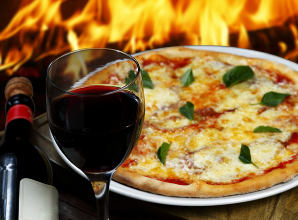 Pizza with glass of wine - Фото, зображення