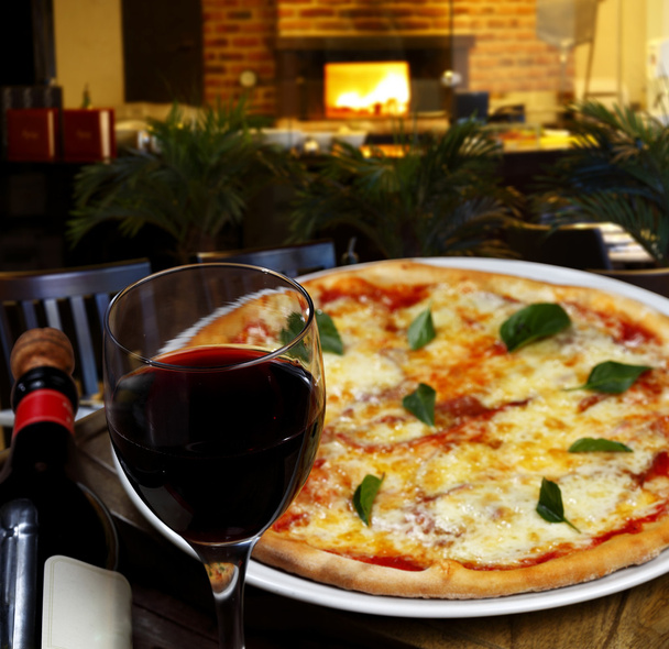 Pizza with glass of wine - 写真・画像