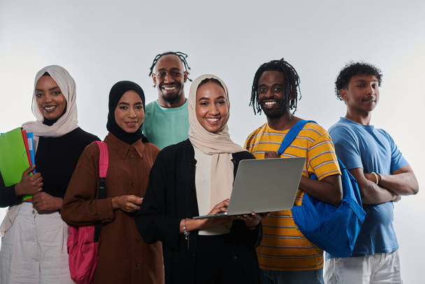 Group of diverse students engages in modern educational practices, utilizing a variety of technological tools such as laptops, tablets, and smartphones against a clean white background, exemplifying - Foto, Imagen