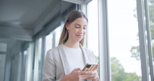 Smile, walking and a woman with a phone at work for communication, email or reading a notification. Social media, happy and a corporate employee in an office with a mobile for an app or the internet. - Footage, Video