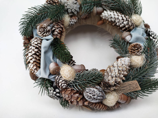 Christmas Wreath of pine branches, cones, leaves, beads and snowflakes. Holiday Decoration Gift For family and friends. New Year's home wall decor different angles handmade top view, side view - Photo, Image