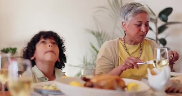 Home, child or happy family eating at dinner celebration with meal, food or lunch for care or support. Relax, grandma or parents at table to share brunch or bond together with smile, kid or love. - Footage, Video