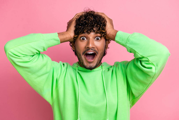 Portrait of funny student surprised hands head amazed speechless and staring he lost deadline list isolated on pink color background. - Foto, Imagem
