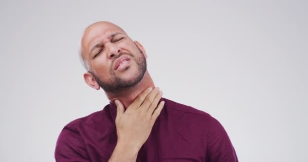 Man, cough and sore throat in pain, sick and bacteria or virus, illness and studio by white background. Male person, cold and flu or lung disease, infection and allergy or pneumonia, asthma or mockup. - Footage, Video