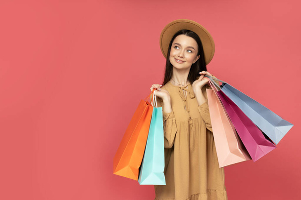 Smiling attractive young woman with shopping bags - Photo, Image
