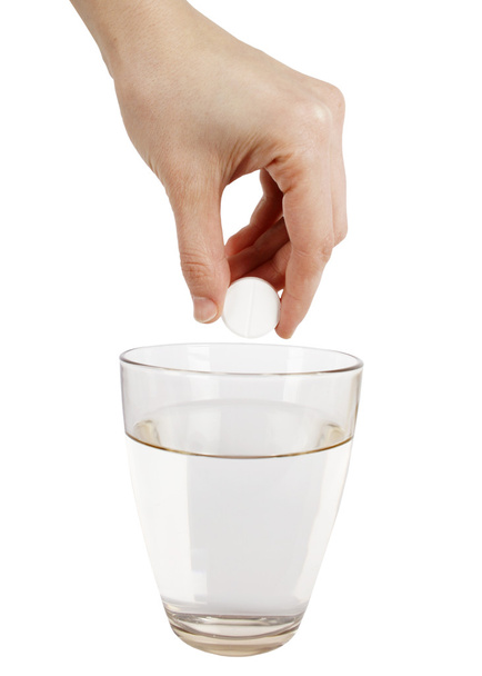 Effervescence tablet and a glass of water - Valokuva, kuva