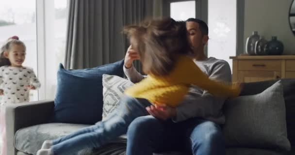 Young kids, dad hug and living room in a family home with love, care and bonding. Running children, father and watching tv of a girl with papa together in a house feeling playful with happiness. - Footage, Video