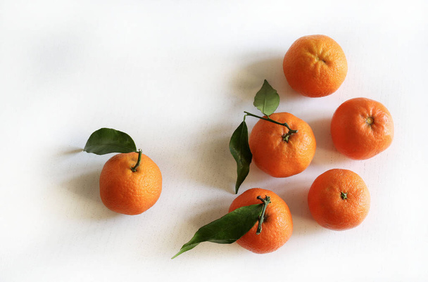 Group of fresh mandarines isolated on white background. Fresh tangerine. Healthy food concept. Overhead view. Copy space. - Photo, Image