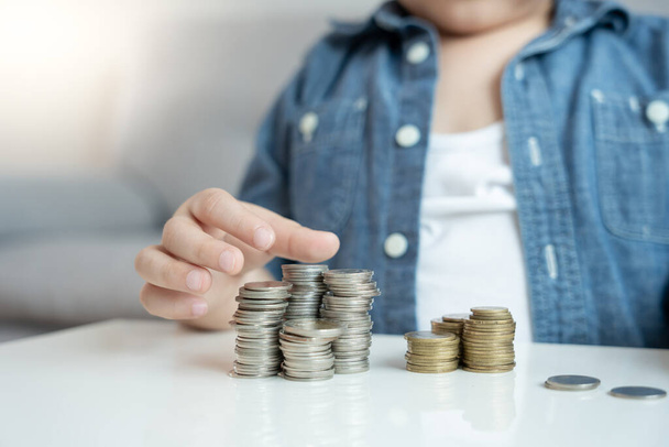 Save money. children putting coin for saving. wealth, Finance, insurance, investment, education, future, plan life, learn, banking, family, health, health and accident insurance. - Fotografie, Obrázek