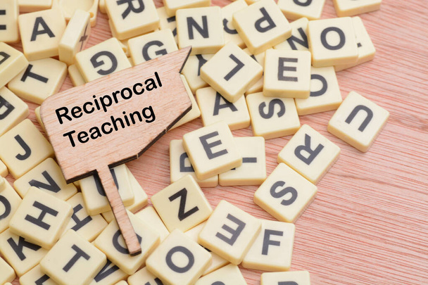 Reciprocal teaching is a structured instructional method used to improve reading comprehension skills, particularly in the context of classroom settings. - Photo, Image