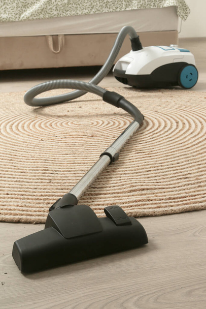 Small and simple vacuum cleaner in the apartment - Photo, Image