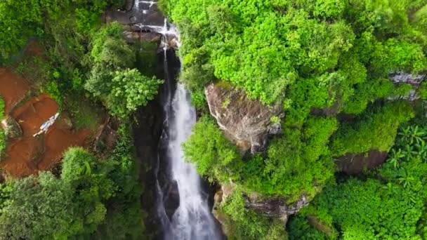 Waterfall among the slope with tea plantations and agricultural lands. Ramboda Falls. - Footage, Video