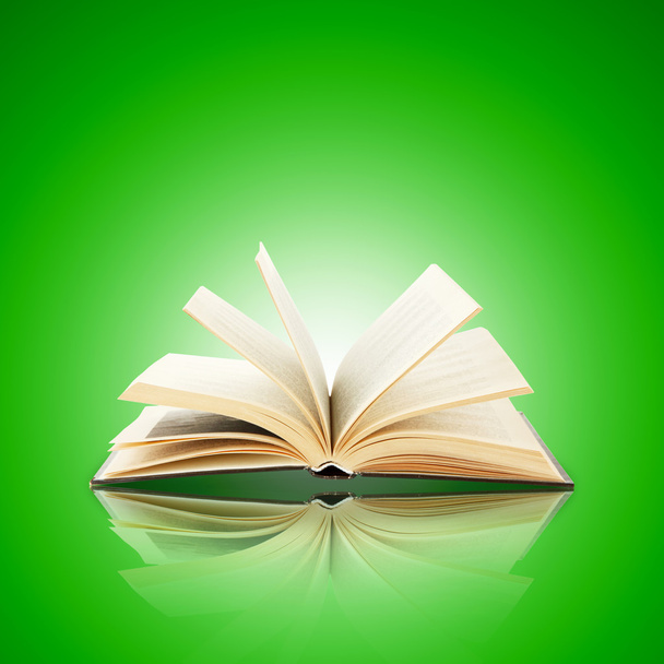 Nyitott könyv, világos zöld háttér - Fotó, kép