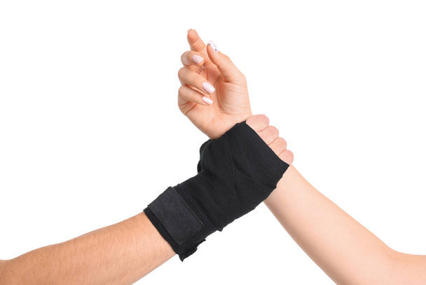 Man grabbed woman hand on white background. Concept of self defense - Photo, Image