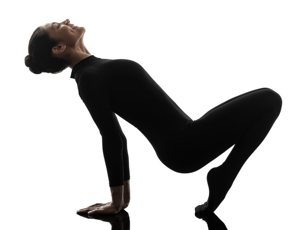 woman contortionist  exercising gymnastic yoga   silhouette - Zdjęcie, obraz