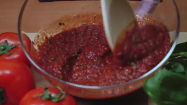 Close-up of chefs hand stirring sauce. Frame. Close-up of chefs hand stirring pot of red sauce. - Footage, Video