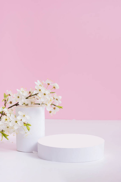 Empty podium or pedestal with spring bloom. Mock up for cosmetic products. - Photo, Image