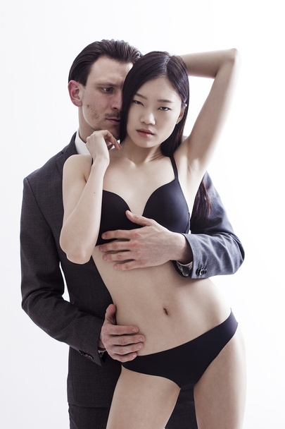 Businessman and chinese model couple portrait - Fotó, kép